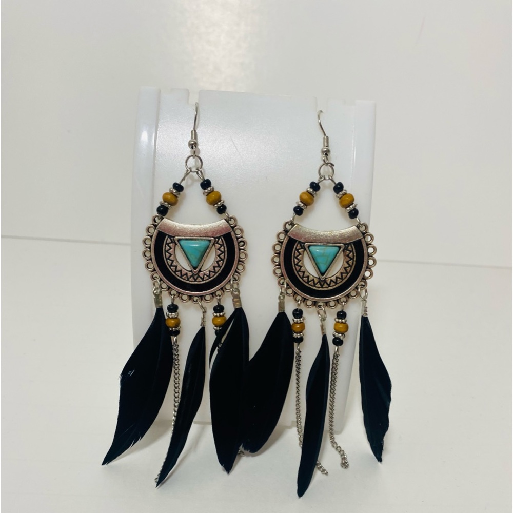 Feather chandelier earrings made by EvileyebyMaria